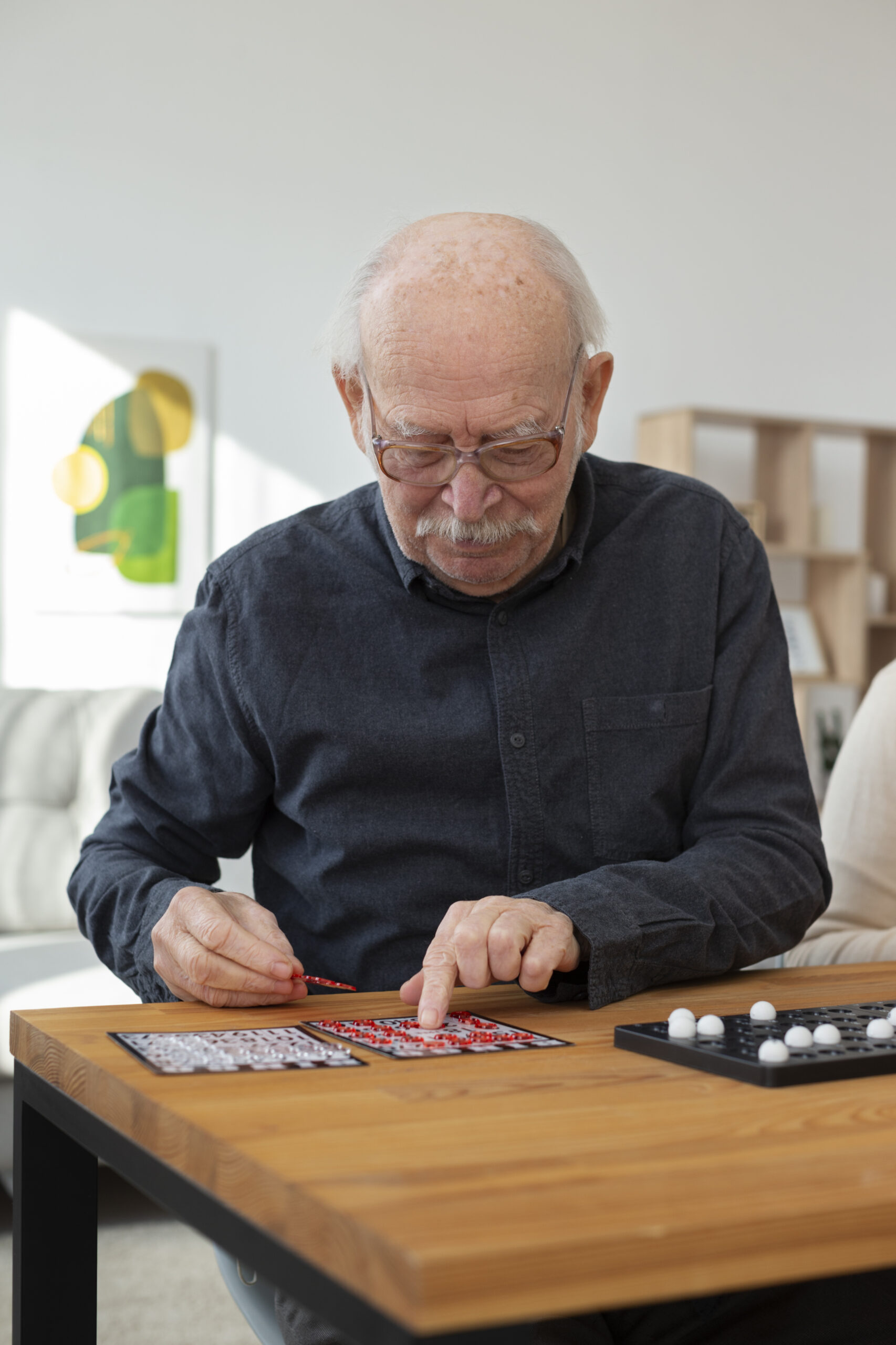 medium shot senior man playing bingo